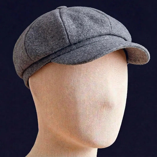 Béret gavroche unisex en coton gris porté de profil